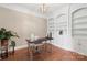 Office space with built-in shelving, wood floors, and contemporary decor for a functional workspace at 2817 Bevis Ln, Waxhaw, NC 28173