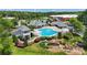 Aerial view of community pool area; featuring a large in-ground pool, water slide, cabana and meticulous landscaping at 2817 Bevis Ln, Waxhaw, NC 28173