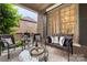 Cozy porch with comfortable seating, stylish pillows, and a view of the home's brick exterior at 2817 Bevis Ln, Waxhaw, NC 28173