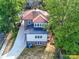 Aerial view of the house highlighting the roof, yard, and the home's position within a tree-lined neighborhood at 300 W Thomas St, Salisbury, NC 28144