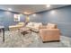 Cozy basement living room with neutral furnishings and a soft rug at 300 W Thomas St, Salisbury, NC 28144