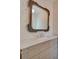 Bathroom featuring marble countertop, designer mirror and vanity with drawers at 300 W Thomas St, Salisbury, NC 28144