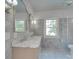 Bright bathroom with double vanity, marble countertop, and large windows at 300 W Thomas St, Salisbury, NC 28144