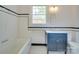 Classic bathroom featuring black and white tiles, a bathtub, and a stylish vanity at 300 W Thomas St, Salisbury, NC 28144