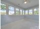 Sunroom features light blue walls, tile floors, and a wall of windows at 300 W Thomas St, Salisbury, NC 28144