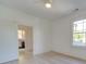Bedroom with hardwood floors, a window, and an ensuite bathroom at 300 W Thomas St, Salisbury, NC 28144