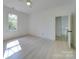 Bright, airy bedroom with a ceiling fan, light wood floors, and large window at 300 W Thomas St, Salisbury, NC 28144