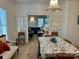 Elegant dining room featuring a chandelier and open access to the comfortable living room at 300 W Thomas St, Salisbury, NC 28144