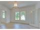 Bright dining room featuring hardwood floors, chandelier, and lots of windows at 300 W Thomas St, Salisbury, NC 28144