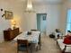 Bright dining room featuring a chandelier, floral table cover and vintage furniture at 300 W Thomas St, Salisbury, NC 28144