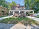 Inviting brick home with a spacious front porch and a well-maintained lawn, creating a cozy curb appeal at 300 W Thomas St, Salisbury, NC 28144