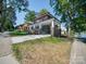 Exterior view of brick home with a covered front porch, white columns, and newly installed driveway at 300 W Thomas St, Salisbury, NC 28144