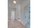Bright hallway with hardwood floors and access to the bathroom and bedroom at 300 W Thomas St, Salisbury, NC 28144