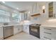 Modern kitchen with black appliances, white cabinets and subway tile backsplash at 300 W Thomas St, Salisbury, NC 28144