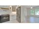 Modern kitchen featuring white cabinets, stainless appliances, and subway tile backsplash at 300 W Thomas St, Salisbury, NC 28144