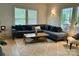 Bright and airy living room with a comfortable couch and plenty of natural light at 300 W Thomas St, Salisbury, NC 28144