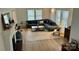 Bright living room featuring a comfortable couch, patterned rug, fireplace and plenty of natural light at 300 W Thomas St, Salisbury, NC 28144