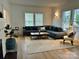 Cozy living room with a comfortable couch, patterned rug, fireplace and plenty of natural light at 300 W Thomas St, Salisbury, NC 28144