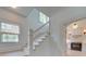 Bright and airy staircase with hardwood floors and a stained-glass window, blending classic charm with modern elegance at 300 W Thomas St, Salisbury, NC 28144