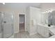 Bright bathroom featuring a glass enclosed shower, white vanity, and wood look floors at 3104 Highgate Dr, Fort Mill, SC 29715