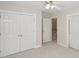 Bedroom featuring a closet, open door, and neutral carpet at 3104 Highgate Dr, Fort Mill, SC 29715