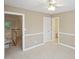 Modest bedroom with a ceiling fan, and view to the downstairs landing at 3104 Highgate Dr, Fort Mill, SC 29715