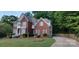 Elegant two-story brick home showcasing its well-maintained lawn and inviting driveway at 3104 Highgate Dr, Fort Mill, SC 29715