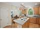 Well-equipped kitchen island with cooktop, alongside open access to a connected dining and living area at 3104 Highgate Dr, Fort Mill, SC 29715