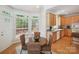 Eat-in kitchen with wood cabinets and large windows overlooking the outdoor deck at 3104 Highgate Dr, Fort Mill, SC 29715
