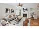 Inviting living room featuring a fireplace, hardwood floors, and natural light at 3104 Highgate Dr, Fort Mill, SC 29715