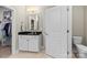 Bathroom with a vanity, granite countertop, and access to the toilet and closet at 329 Secretariat Dr, Iron Station, NC 28080