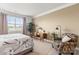 Bedroom with a large window, cozy chair, and a side table at 329 Secretariat Dr, Iron Station, NC 28080