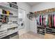 Walk-in closet with shelving, hanging space, dresser, connects to laundry room for added convenience at 329 Secretariat Dr, Iron Station, NC 28080