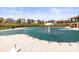 Large community pool with a covered tarp, next to a community center and other amenities at 329 Secretariat Dr, Iron Station, NC 28080