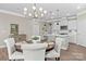 Dining area with stylish chandelier adjacent to kitchen and living room at 329 Secretariat Dr, Iron Station, NC 28080