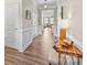 Inviting entryway with hardwood floors, a stylish console table, and access to other living spaces at 329 Secretariat Dr, Iron Station, NC 28080