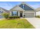 Charming single-Gathering home featuring manicured lawn, neutral colors, and a two-car garage at 329 Secretariat Dr, Iron Station, NC 28080