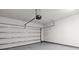 Clean and spacious two-car garage with an automatic door opener and sealed concrete floors at 329 Secretariat Dr, Iron Station, NC 28080