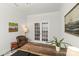 Bright home office with french doors, hardwood floors, and neutral decor at 329 Secretariat Dr, Iron Station, NC 28080