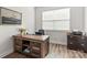 Home office featuring rustic desk and ample natural light from a large window at 329 Secretariat Dr, Iron Station, NC 28080