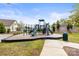 Community playground area with slides, climbing equipment, and a soft surface for safety at 329 Secretariat Dr, Iron Station, NC 28080