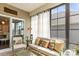 Bright sunroom featuring large windows, comfortable seating, and stylish decor at 329 Secretariat Dr, Iron Station, NC 28080