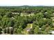 Bird's eye view of property near golf course, with lush greenery and mature trees at 3712 Eaglebrook Dr, Gastonia, NC 28056