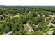 Aerial shot of two houses, surrounded by mature trees and green spaces, close to golf course at 3712 Eaglebrook Dr, Gastonia, NC 28056
