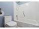 Fresh bathroom featuring a toilet and white-tiled tub with shower at 3712 Eaglebrook Dr, Gastonia, NC 28056