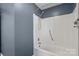 Bathroom featuring a low step-over tub with handrails and a shower at 3712 Eaglebrook Dr, Gastonia, NC 28056