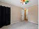 Neutral bedroom with a ceiling fan and black curtain in place at 3712 Eaglebrook Dr, Gastonia, NC 28056