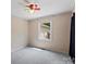 Neutral bedroom featuring a ceiling fan, window and neutral carpeting at 3712 Eaglebrook Dr, Gastonia, NC 28056