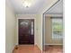 Warm foyer with hardwood floors, neutral walls, and a decorative front door and trim at 3712 Eaglebrook Dr, Gastonia, NC 28056