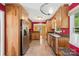 Updated kitchen with stainless steel appliances, tile flooring, and adjacent dining area at 3712 Eaglebrook Dr, Gastonia, NC 28056